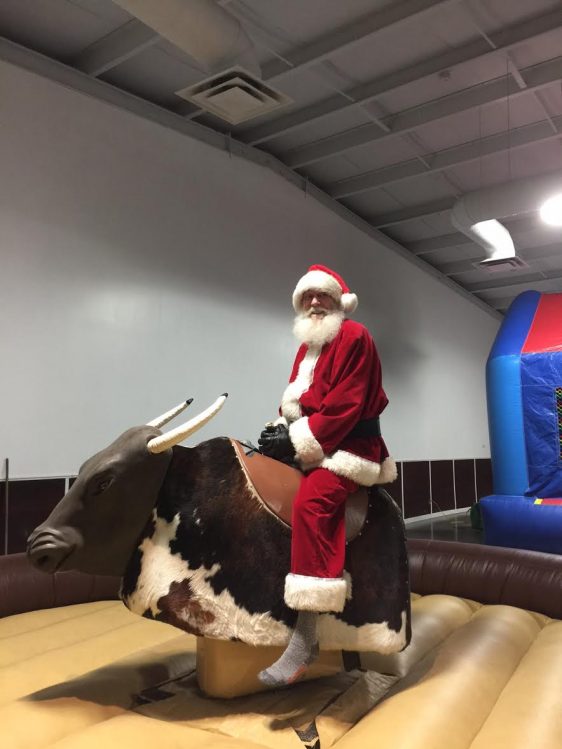 Santa riding a bull